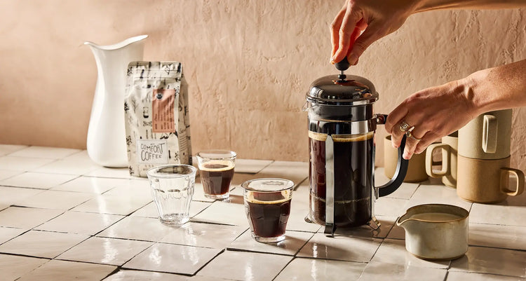 package of Mt Comfort 12 oz coffee beans and Chemex with mug