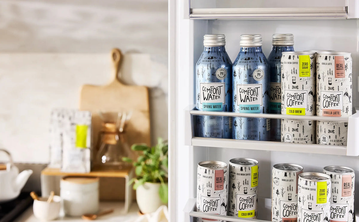 open fridge displaying mt. comfort water and ready-to-drink beverages