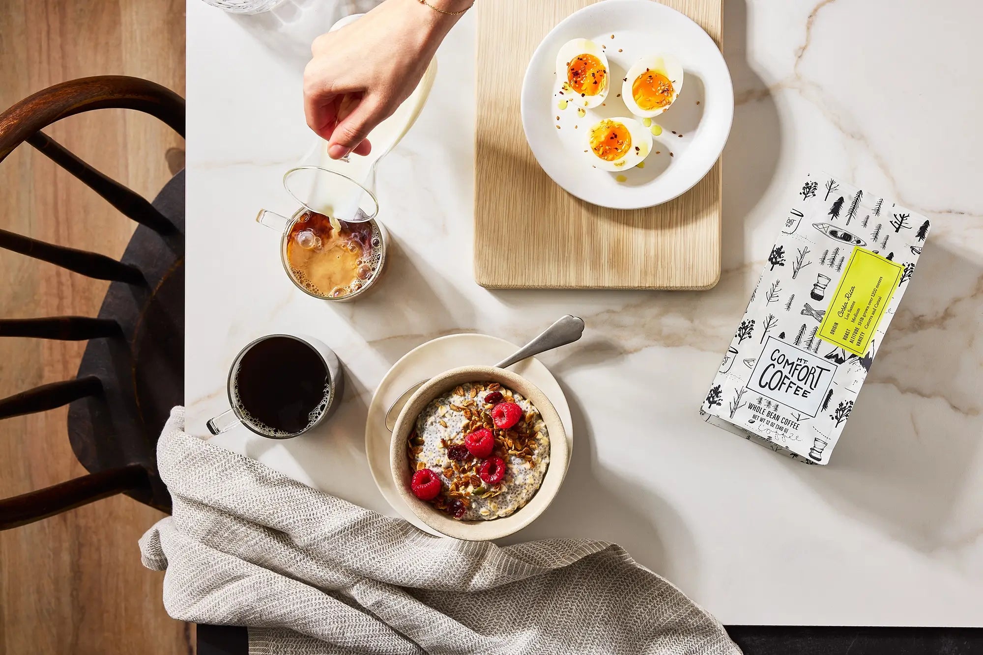 Breakfast scene with 12oz bag of Mt Comfort whole bean coffee from Costa Rica